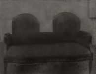 Photomontage d\'un canapé noir avec un double dossier.